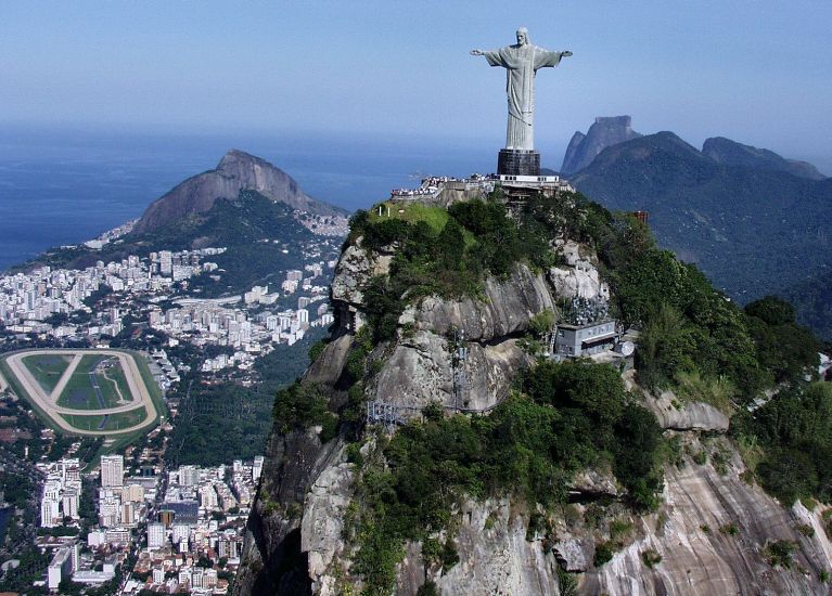 The giant statue of Jesus atop Corcovado mountain above Rio de Janeiro