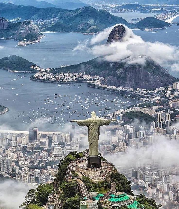 The giant statue of Jesus atop Corcovado mountain above Rio de Janeiro