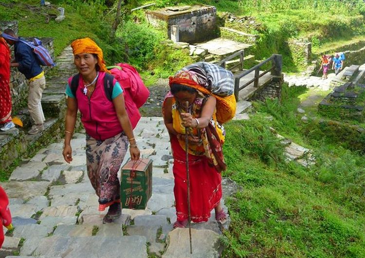 Nepalese women on stone stairway on route to Annapurna Sanctuary