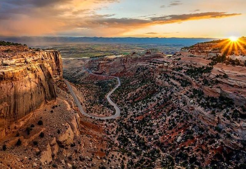 View from Rim Rock Drive of sunrise at Colorado National Monument