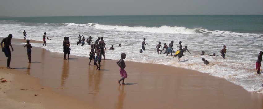 Gambian boys swimming at beach at Brufut