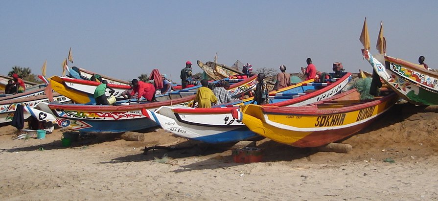 Brightly Painted Fishing Boats on beach at Ghana Town
