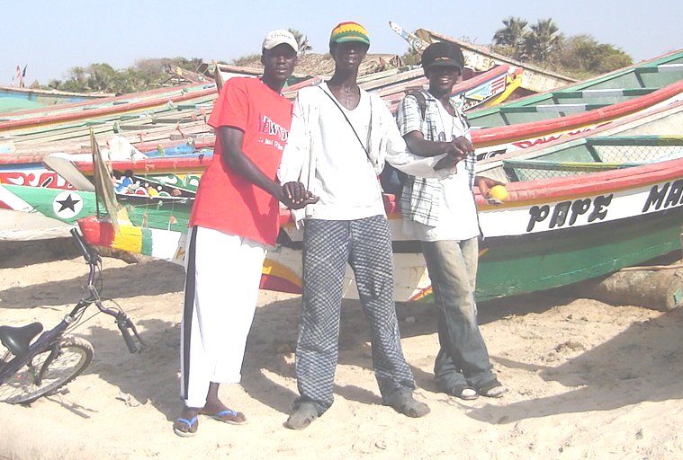 Gambians and Fishing Boats on beach at Ghana Town