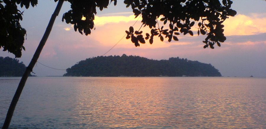 Sunset over Pulau Pangkor Laut from Pasir Bogak on Pulau Pangkor off Peninsular Malaysia