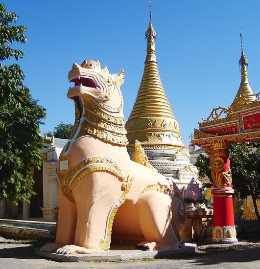 Giant Dragon Dog guarding temple entrance at Amarapura