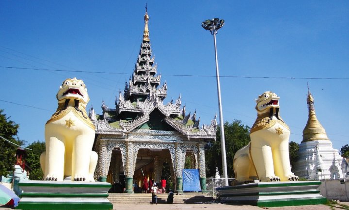 Giant Dragon Dogs guarding Burmese-style temple at Amarapura