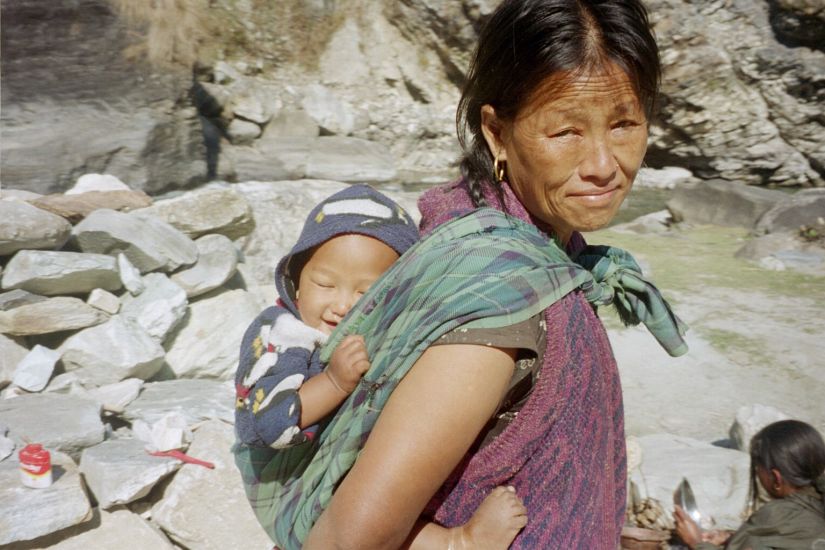 Photograph of Nepalese woman carrying baby