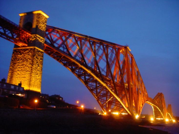 Forth Railway Bridge illuminated at night