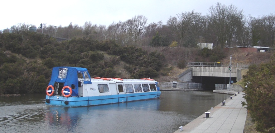 Boat entering Roughcastle Tunnel on the Union Cana near the Falkirk Wheell