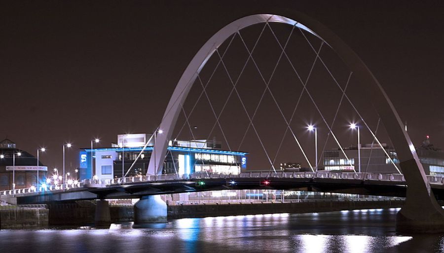 Clyde Arc Bridge illuminated at night in Glasgow, Scotland