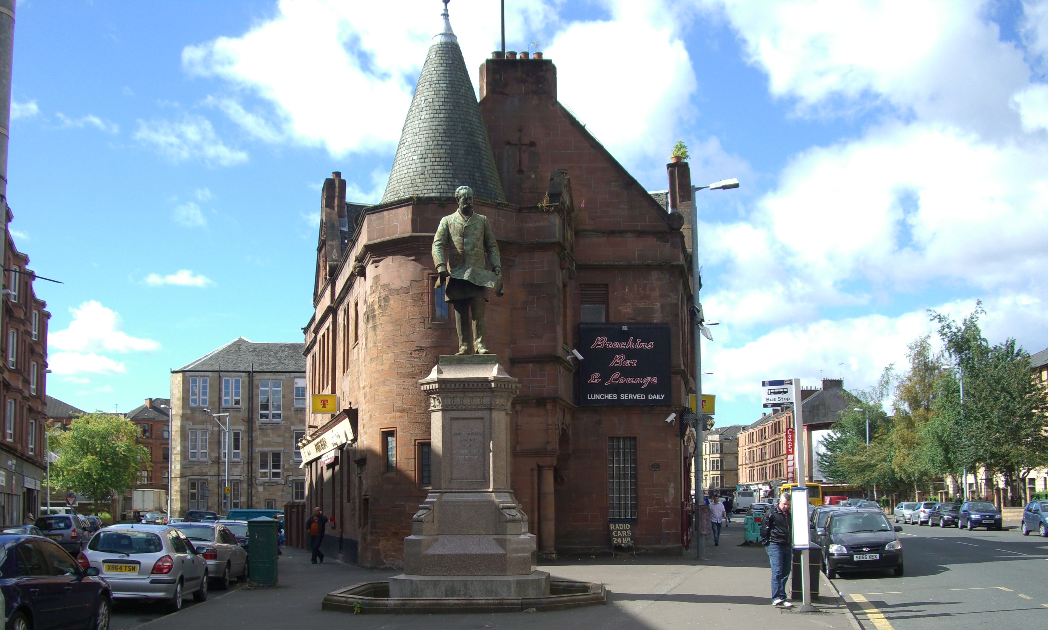 Sir William Pearce statue in front of the Pearce Institute Building in Govan