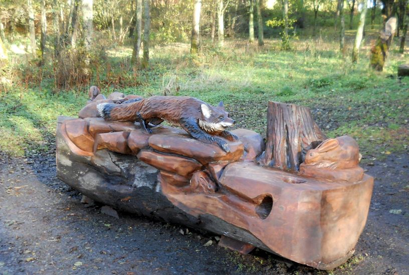 Carved Beech Log Bench at Kilmardinny Loch in Bearsden
