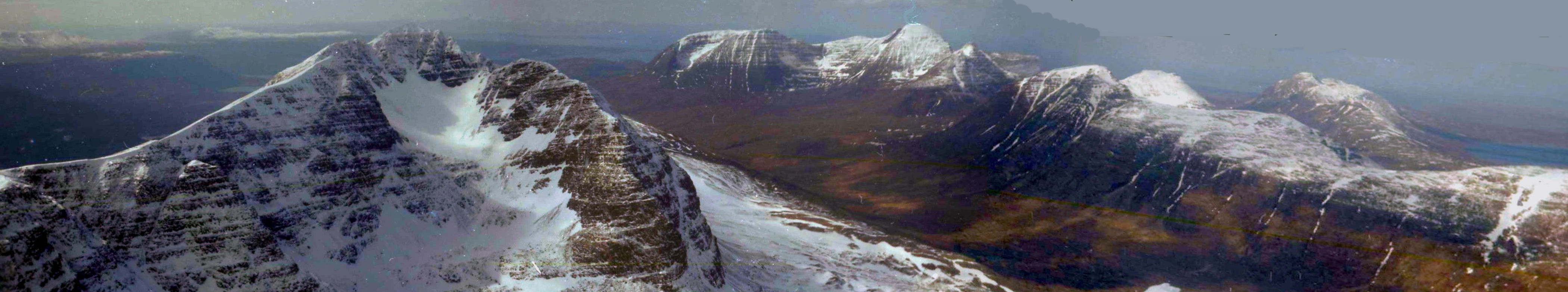 Snow-bound Liathach, Beinn Alligin and Beinn Dearg in winter in the Torridon region of the North West Highlands of Scotland