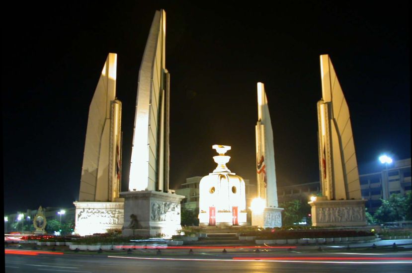 Democracy Monument illuminated at night in Bangkok