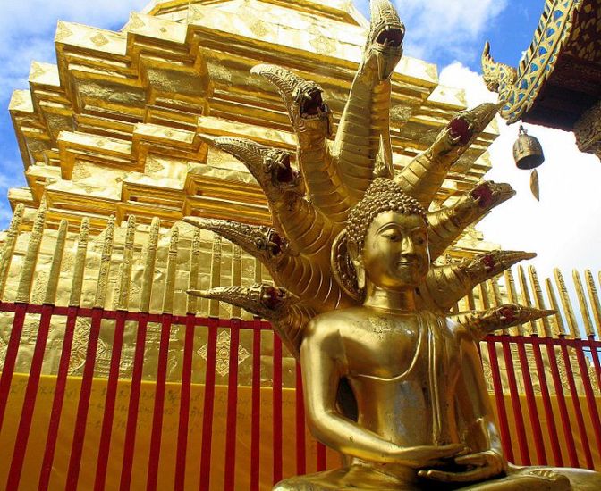 Naga Heads ( maculinda ) covering Buddha statue at Phra That Doi Suthep in Chiang Mai