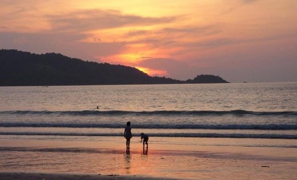 Sunset at beach on Ko Phuket in Southern Thailand