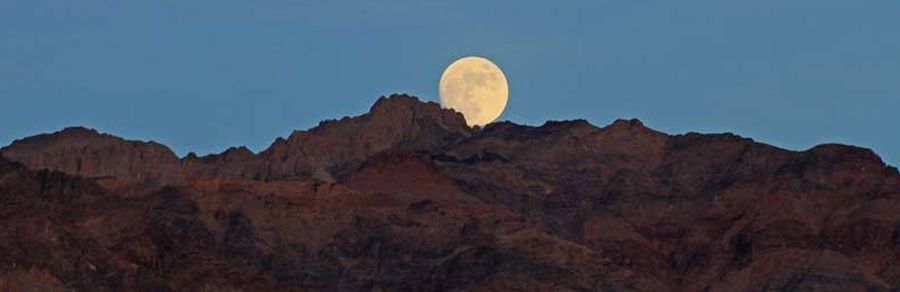 Moon over Zabriesky Point in Death Valley