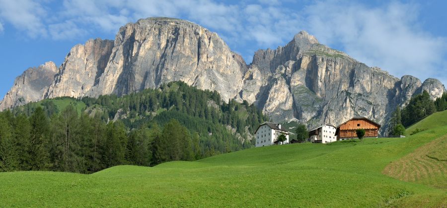 Alpine farmhouse and Zecca da Ruatscht at Corvara in the Italian Dolomites