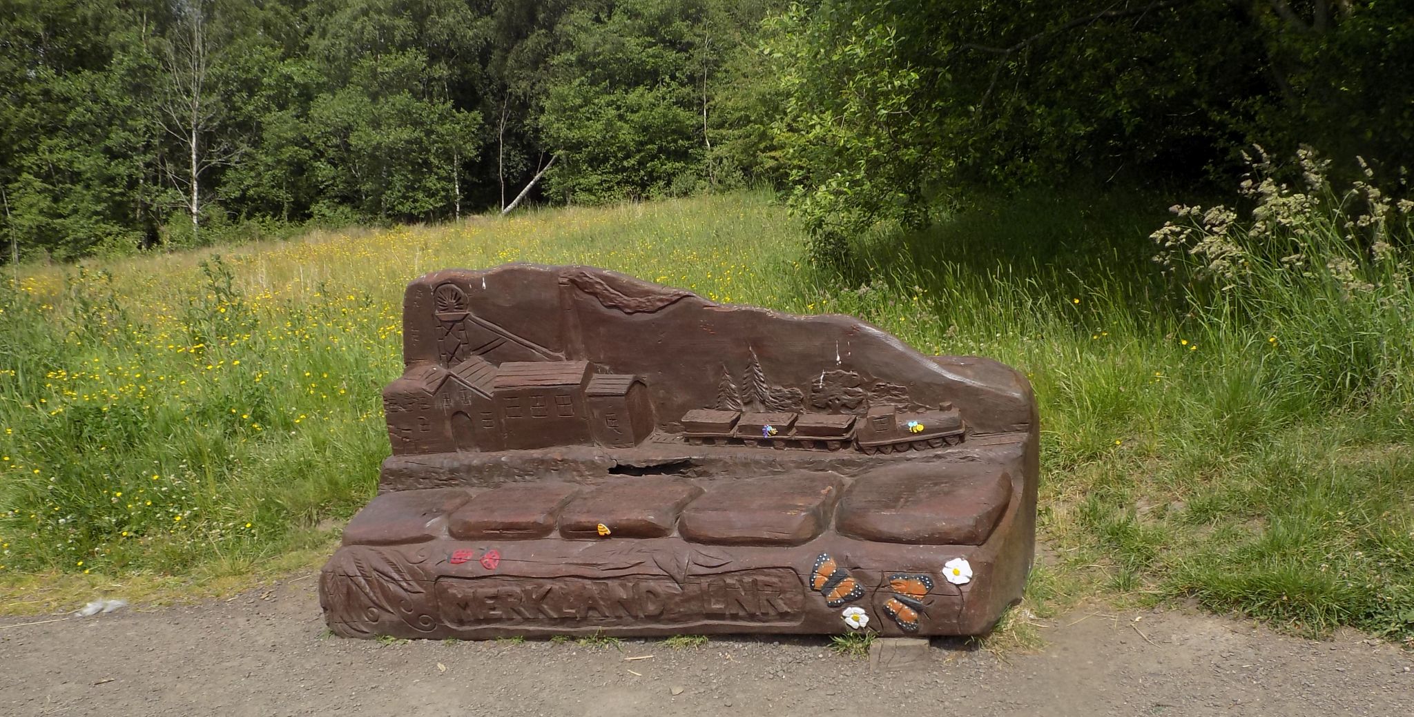 Carved wooden bench in Merkland Nature Park at Kirkintilloch