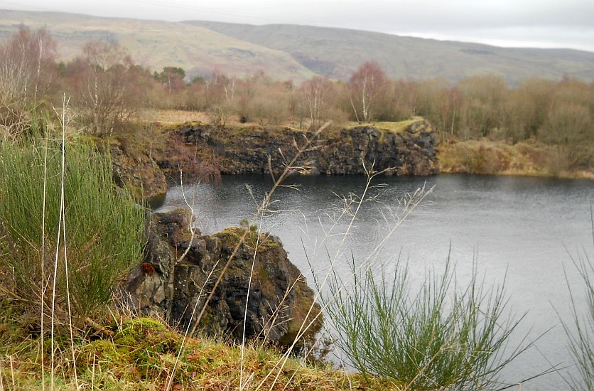 Campsie Fells beyond Peitches Moor and quarry loch in Mugdock Country Park